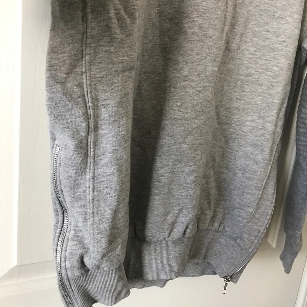 Divided cotton blend gray long sleeve sweater with side zippers